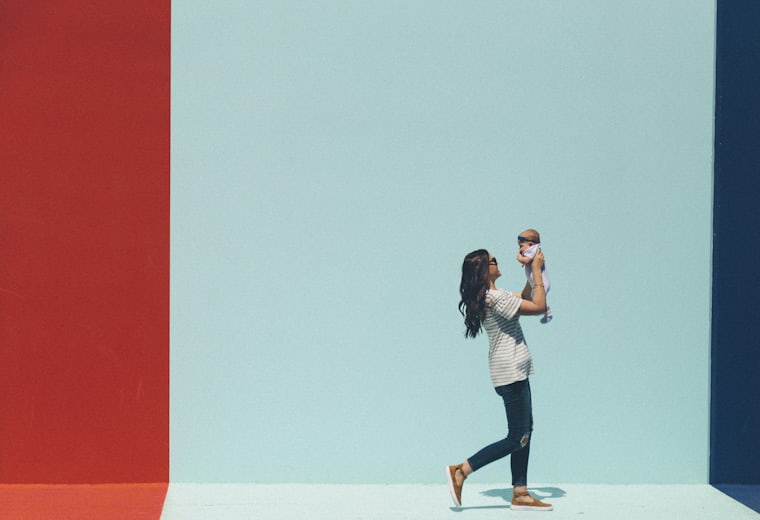 A parent holding a baby